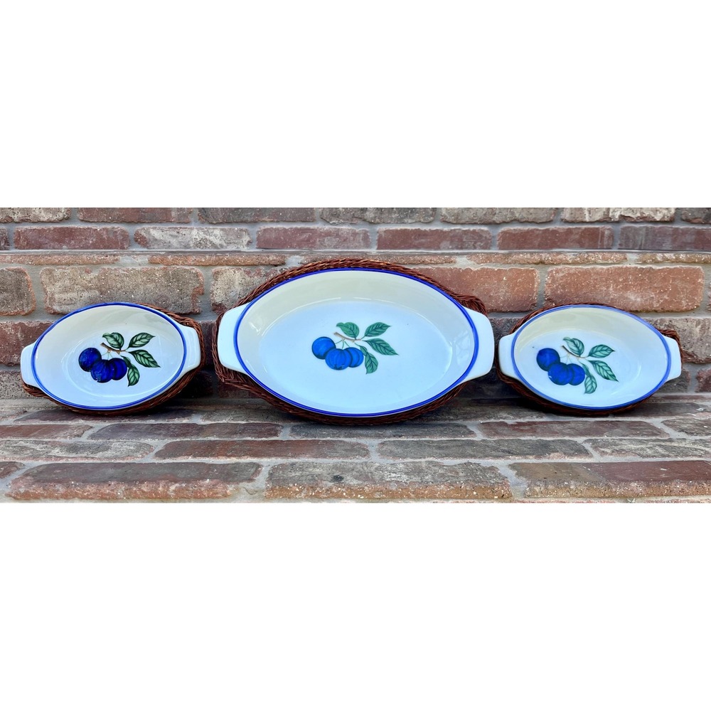 Adorable set of vintage blueberry casserole dishes in wicker baskets. Set of 3.